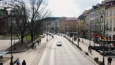 Aerial-drone-view-low-over-the-Royal-route-street,-sunny,-spring-day-in-Warsaw,-Poland