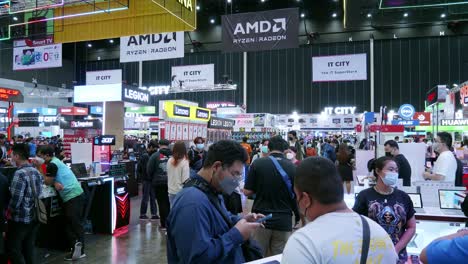 People-walking-and-shopping-in-Commart-Thailand-2022-computer-technology-event-at-Bitec-Bangna-Bangkok,-Thailand