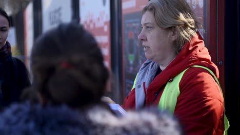 Ukrainian-volunteer-gives-forms-and-bits-of-advice-to-the-war-refugees-at-the-registration-center-on-the-National-Stadium-in-Warsaw-to-receive-a-Polish-social-security-number