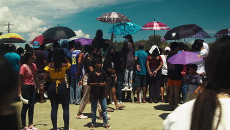 Crowd-gathers-near-the-race-track-on-day-2-of-the-motocross-competition