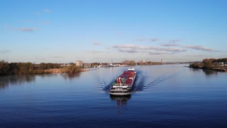 Aerial-View-Of-Cornelis--R-Barge-With-Shipping-Containers-Sailing-At-Noord-River-In-South-Holland,-Netherlands