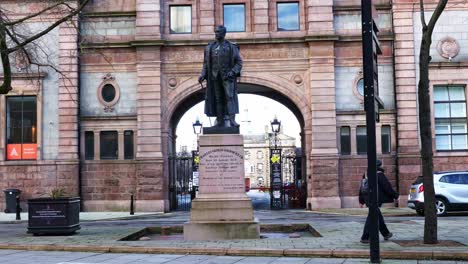 Man-walks-past-the-statue-of-General-Gordon-of-Khartoum-outside-Robert-Gordon's-College-in-Aberdeen