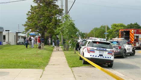 Police-Cars-And-A-Fire-Truck-Within-The-Yellow-Barrier-Tape-At-The-Scene-Of-A-Vehicular-Accident-In-Toronto,-Canada