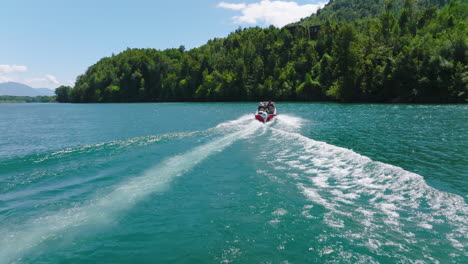 Aerial-Following-Speedboat-Wake-On-Puelo-River-In-Lake-District,-Chile