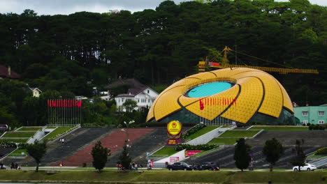 Static-view-of-supermarket-C-developed-on-underground-level-with-its-yellow-big-dome-in-Yersin-Park-Da-Lat