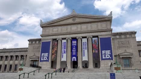 Timelapse-of-People-Entering-Museum-Under-Cloudy-Sky