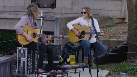 Acoustic-duo-concert-at-Dogwood-Festival-in-Siloam-Springs,-AR,-wide-shot