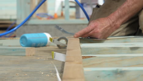 SLOW-MOTION-Old-Carpenter-Hands-Hammer-Nail-Into-Timber