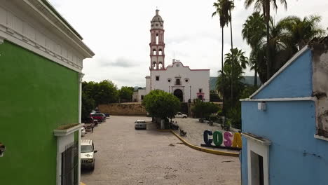 Low-fly-of-colorful-streets-and-church-in-Magical-Town-of-Cosala-Downtown