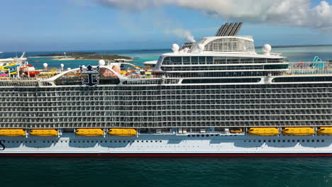 Drone-shot-of-the-Wonder-Of-The-Seas-Royal-Caribbean-cruise-ship-at-dock,-panning