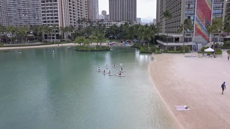 Aerial-view-of-sup-yoga-class-at-Hilton-Hawaiian-village-lagoon