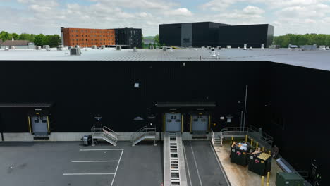 Rising-shot-of-deliver-bays-for-semi-trucks-in-warehouse