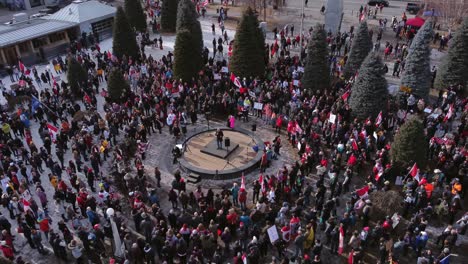 Freedom-protest-approaching-speaker-Calgary-downtown-aerial