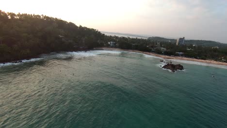 Aerial-view-of-the-sea-and-its-surroundings-and-boats-are-roaming-on-the-sea