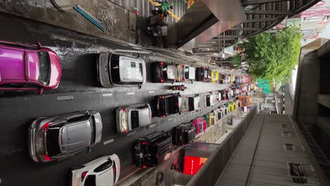 Vertical-video---Bad-traffic-on-a-rainy-day-at-Silom,-Bangkok,-Thailand