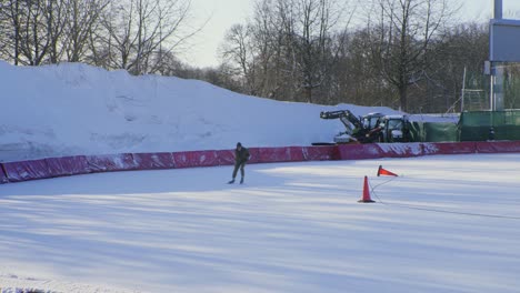 Old-man-speed-ice-skating-at-Frogner-park-in-Oslo,-Norway