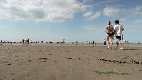 People-Walking-Towards-The-Bay-At-Margate-Beach-On-Sunny-Day-on-23-July-2022