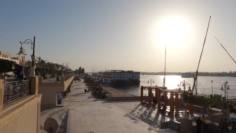 Tourist-Travel-Boats-Docked-At-The-Side-Of-The-Nile-River,-Luxor,-Egypt