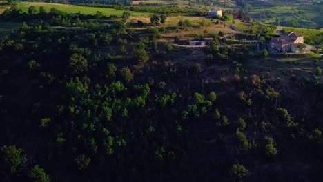 Rising-and-turning-hilltop-view-of-Ardèche-farmhouse-and-vineyard