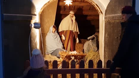 Young-girl-watching-reenactment-of-Jesus-Christ-in-the-crib