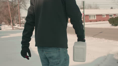 Spreading-Rock-Salt-on-Icy-Sidewalk-in-Residential-Area-SLOW-MOTION