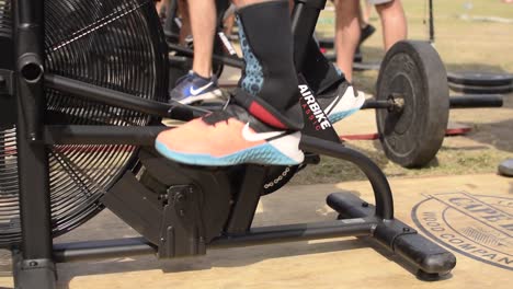 Tight-Shot-of-Cross-Fit-Athletes-on-Air-Bikes-at-a-Competition