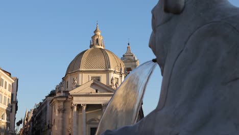 Tilt-up-shoot-for-lion-fountain-with-tourists-and-church-of-the-artists-of-people’s-square-in-background