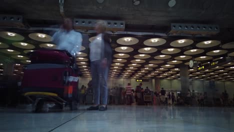 A-motion-lapse-of-an-airport-arrivals-room-with-many-people-in-it