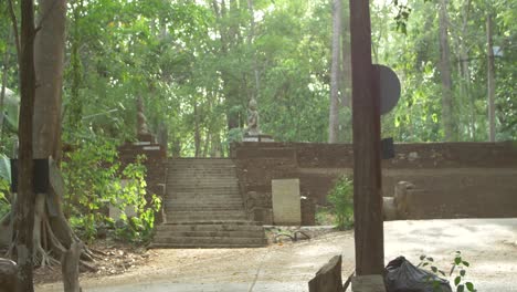 POV-view-walking-around-green-surrounding-at-buddhist-Wat-Umong-stupa