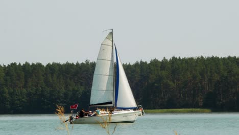 Yacht-sailing-in-Wdzydze-Lake-in-Kaszubski-park-krajobrazowy-in-Pomeranian-Voivodeship