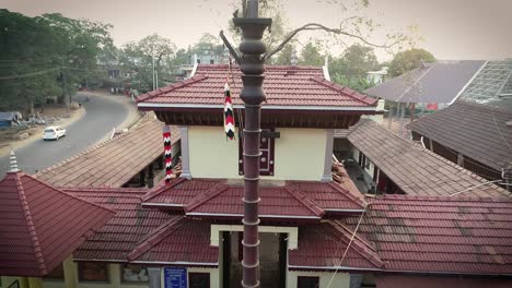 Downward-panning-shot-of-temple-roof,-aerial