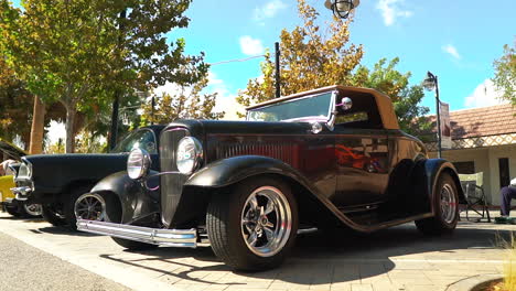 Beautifully-restored-Ford-Model-A-on-display-in-car-show,-pan,-slow-motion