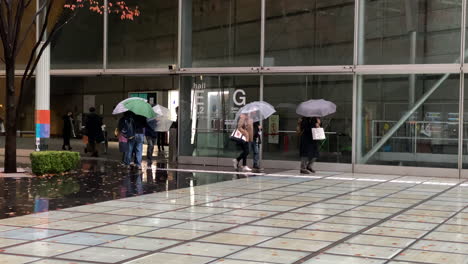 Wide-Angle-view-of-Tokyo-International-Forum-entrance-during-rainy-day-in-Tokyo,-Japan