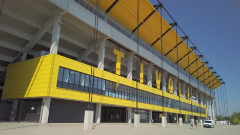 Big-letters-of-the-Tivoli-football-stadium,-located-in-the-German-City-of-Aachen-with-a-pedestrian-bridge-over-a-big-street