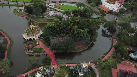 Buddhist-Temples-Replicas-and-Botanical-Garden-in-Ancient-Siam-City-Open-Air-Museum,-Thailand,-Cinematic-Aerial