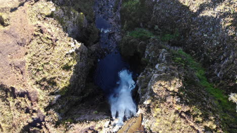 A-flight-over-a-waterfall-in-the-scottish-highlands-along-the-nc500-route