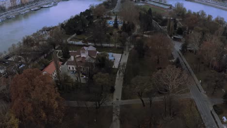 City-of-Budapest-connected-by-bridge-over-River-Danube,-drone-shot