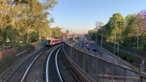 Elevated-trains-on-their-morning-commute-alongside-Tlalpan-Avenue-in-the-southern-part-of-Mexico-City,-Mexico