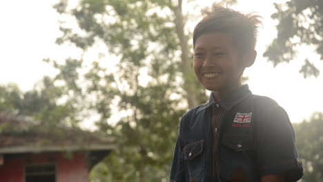 Young-Indonesian-Boy-Laughs-on-a-Trip-in-the-Rainforest-Jungle