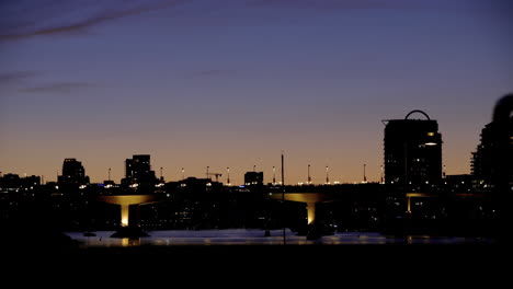 Dusk-shot-city-of-Vancouver-from-a-sea-wall-of-Falls-Creek-people-walking