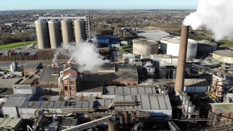 Flying-towards-the-steam-from-the-British-Sugar-factory-in-Bury-St-Edmunds,-Suffolk