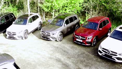 Mercedes-benz-cars-in-line-on-a-car-dealership-parking-lot-on-a-sunny-morning---Aerial-Survey-low-angle-shot