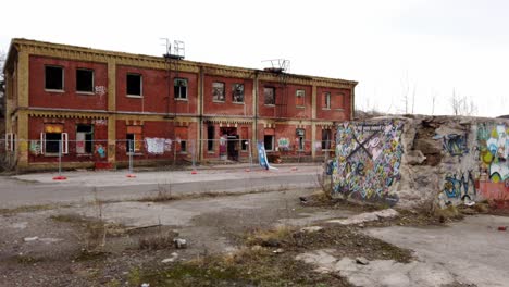 Abandoned-Urban-Warehouse-In-Sweden,-Walls-Tagged-With-Graffiti-Street-Art