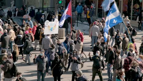 Close-up-of-a-marching-protest-in-Montreal,-Quebec