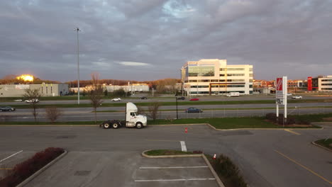 aerial-view-of-truck-in-parking,-highway,-cars,-traffic