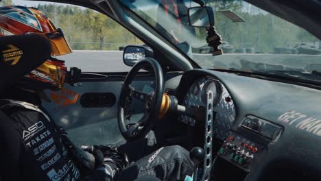 Dashboard-and-driver-of-a-Nissan-240SX-at-drift-car-event-in-Monroe,-Washington