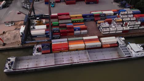 Empty-Cargo-Ship-Docked-Next-To-Eiger-At-Transfer-Facility-In-Ridderkerk