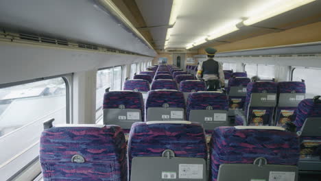 Japanese-Police-Patrolling-Inside-A-Moving-Train-On-The-Railroad-In-Sendai,-Japan