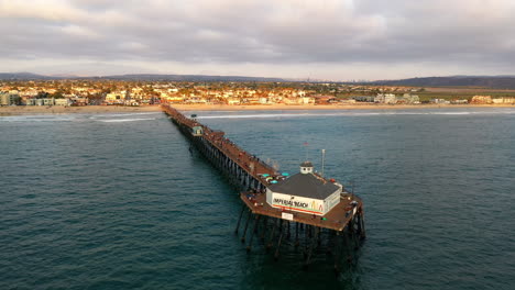 Aerial-flyover-landmark-pier-in-Imperial-Beach,-California