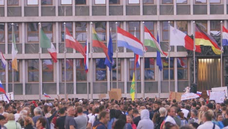 Rally-Protesting-Against-Strict-Anti-COVID-Rules-In-Front-of-the-Parliament-and-European-Flags-in-Ljubljana,-Slovenia